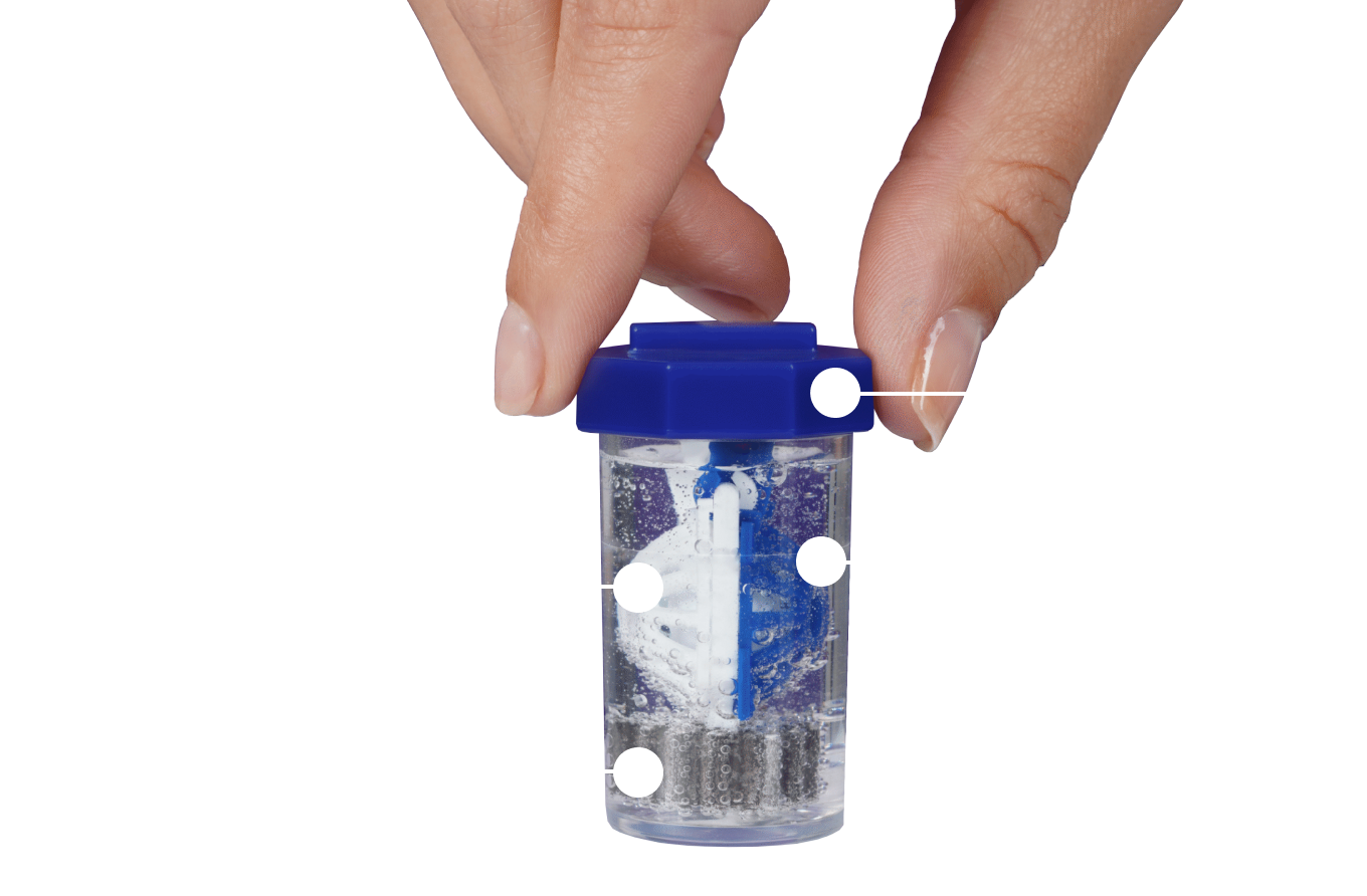 hand screwing the lid of contact lens case into place submerging basket in bubbling hydrogen peroxide contact solution liquid