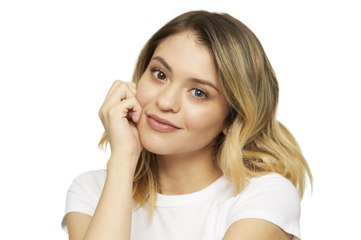 woman with shoulder-length blonde hair and white t-shirt wearing Air Optix Colors color contact lenses in the color, Blue