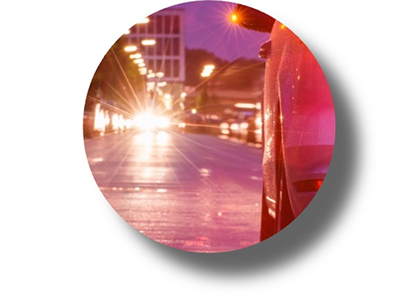 A nighttime view of streetlights with a strong starburst effect, representing visual disturbances