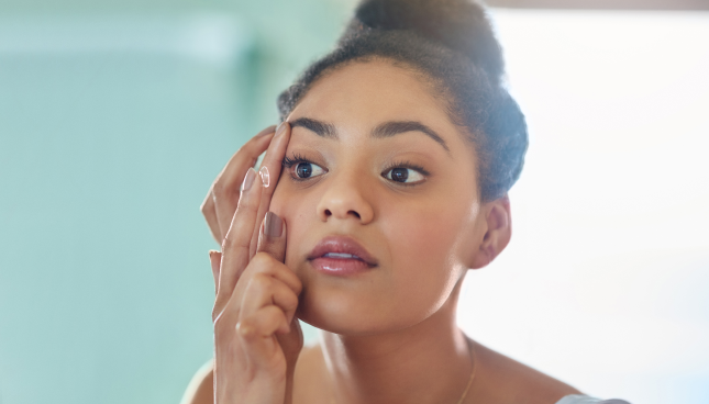 Woman applying a contact lens