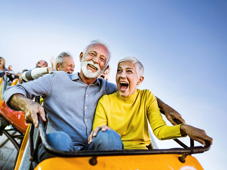 An couple in a yellow trolley.