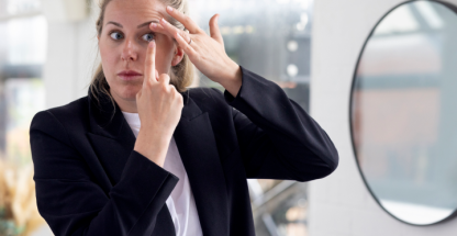Woman putting in a contact lens
