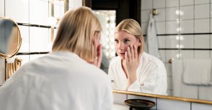 woman removing contact lenses