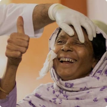 Happy woman receiving eye care