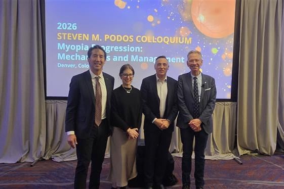 4 people standing on the stage at the 2026 Steven M. Podos Colloquium