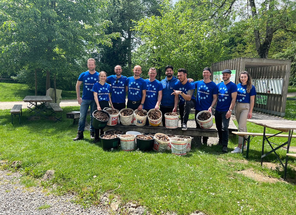 Alcon volunteers showing off their harvest