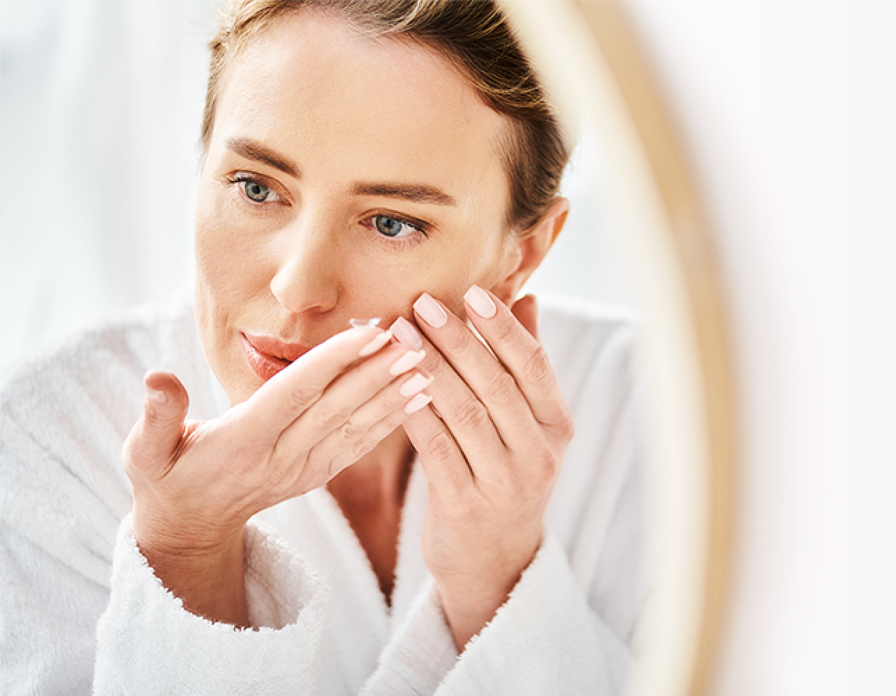 Woman putting in a contact lens